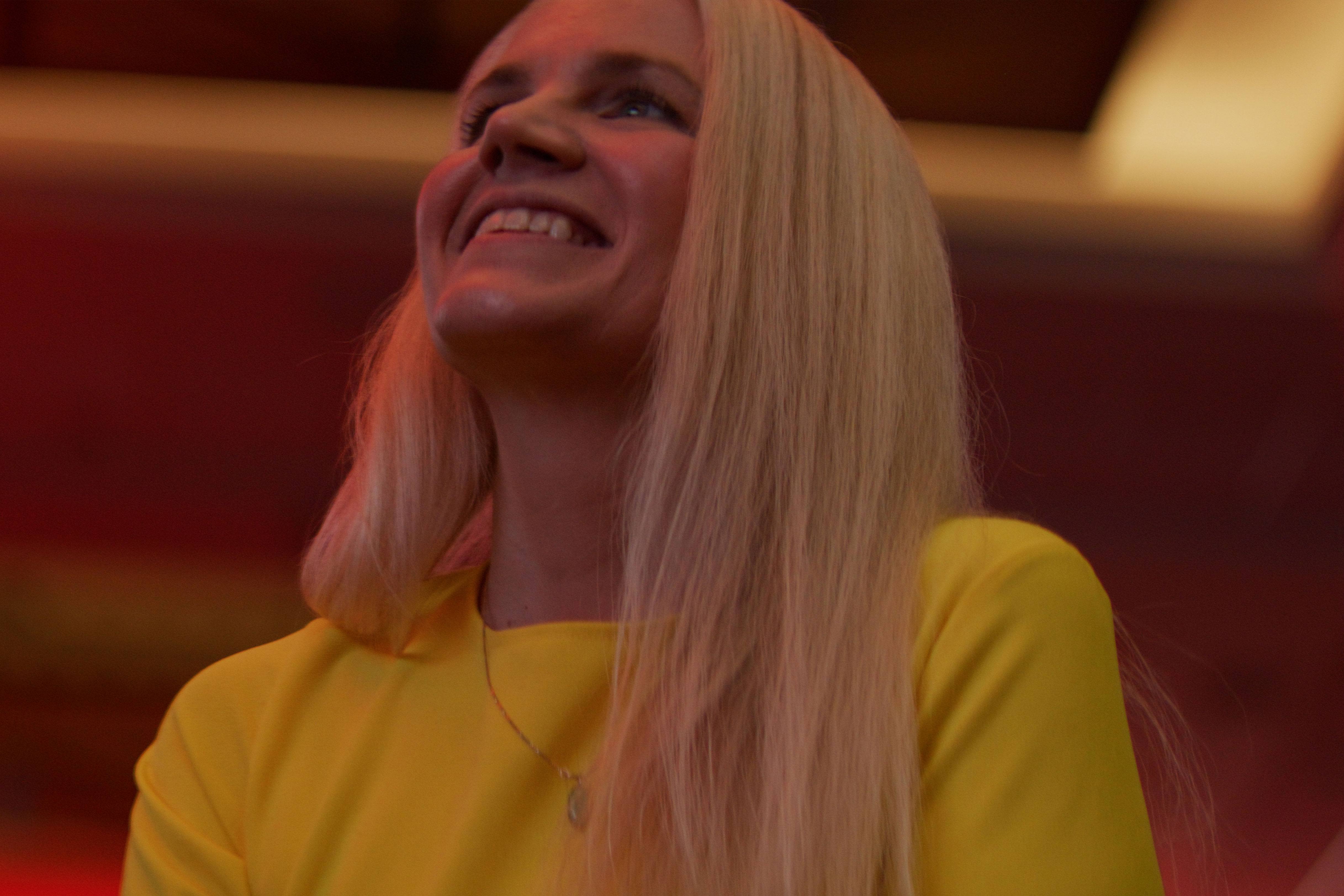 Jennifer Watson smiling under warm studio lighting