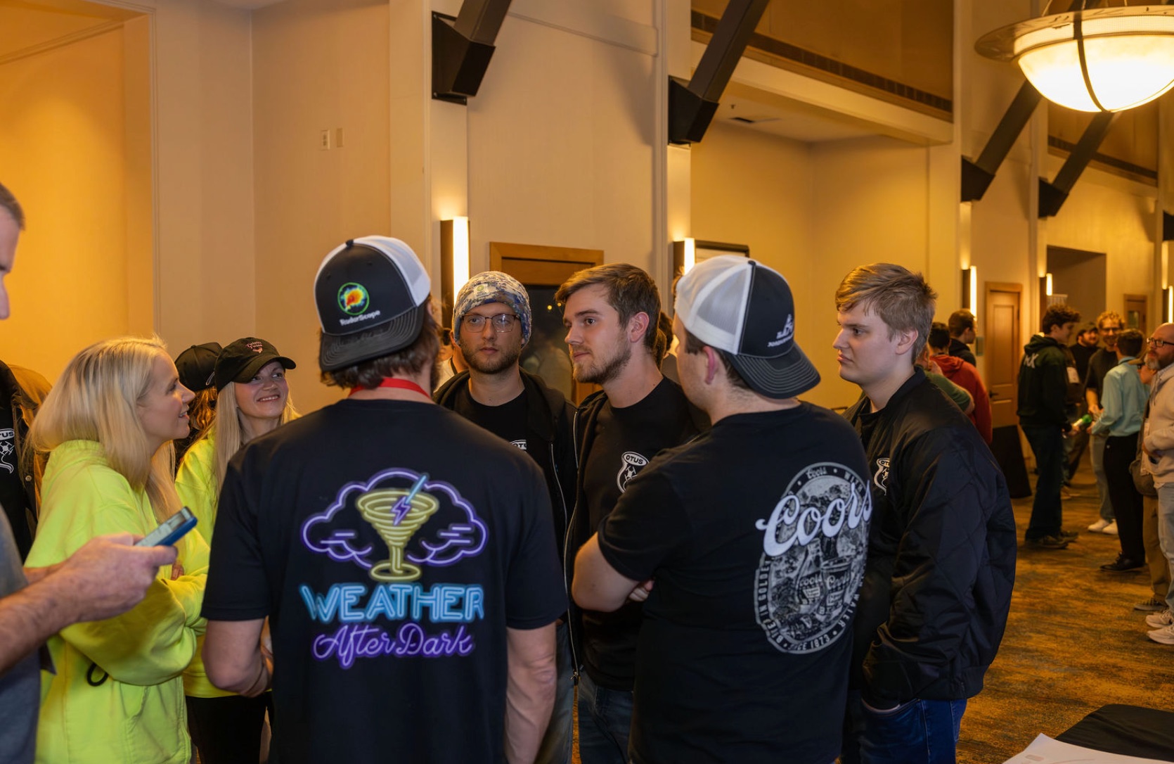 Storm chasers and friends gathered around Weather After Dark merchandise